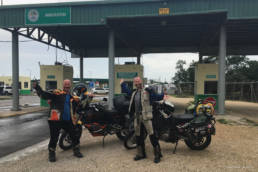 Shawn Cousins and moto.phil at the border between Mexico and Belize