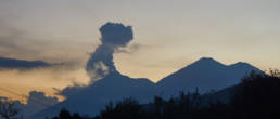 The silhouettes of the two sister volcanoes Volcán de Fuego and Acatenanco at sunset