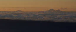 Sunrise view from Unicornio Azul with Volcan de Fuego smoking